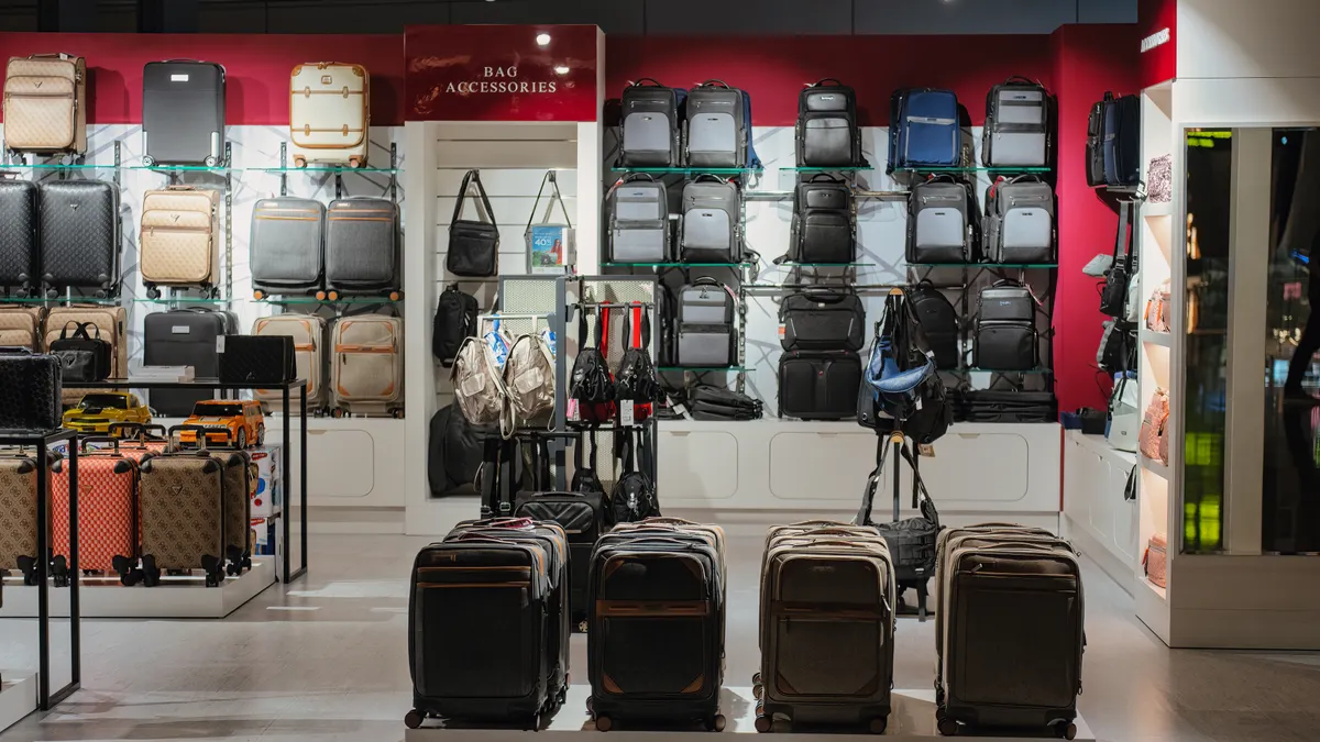 Best Luggage Features to Look For Before You Buy luggage store wall of suitcases